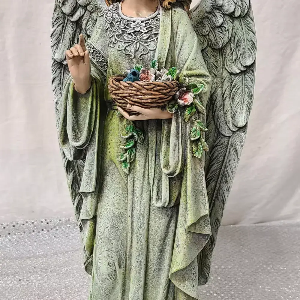 Angel holding a basket with a blue bird
