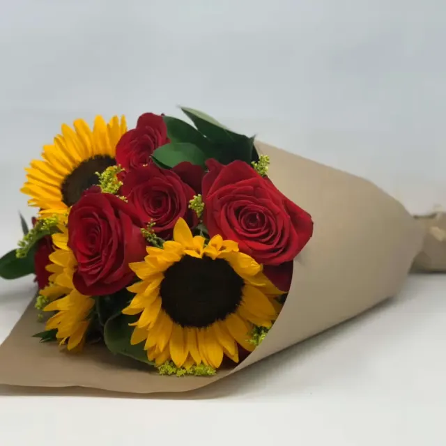 Wrapped sunflowers and roses