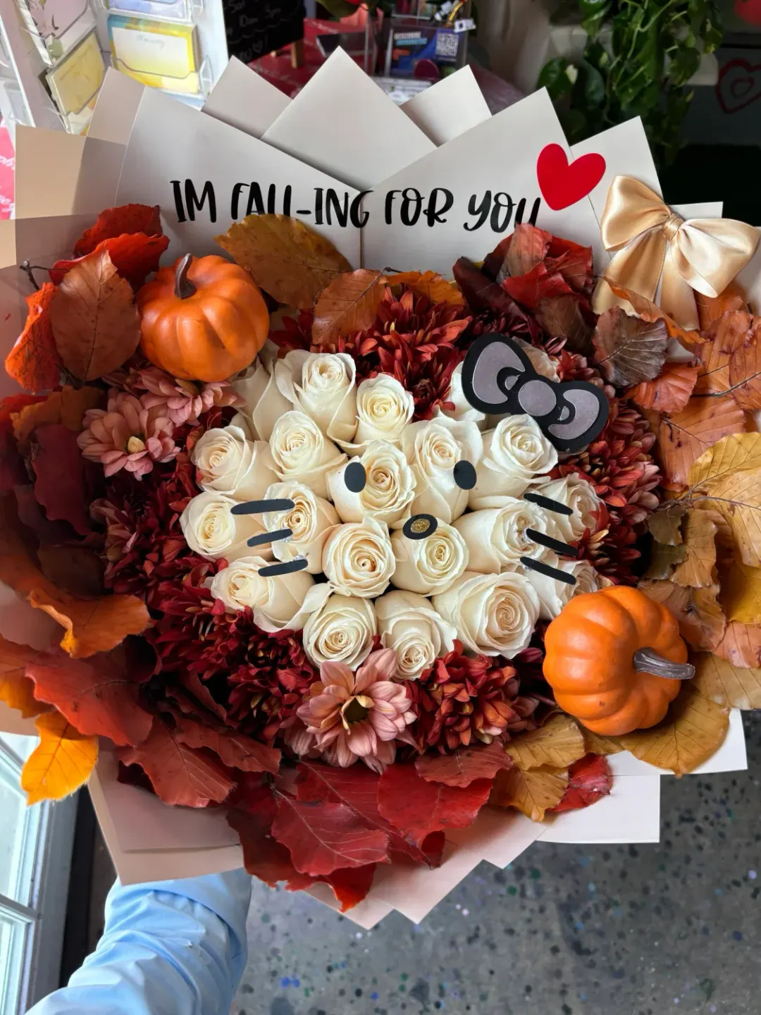 Hello Kitty Face in Fall Flowers