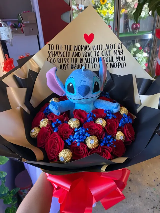 24 Roses, a Stitch Plush and Blue Baby's Breath